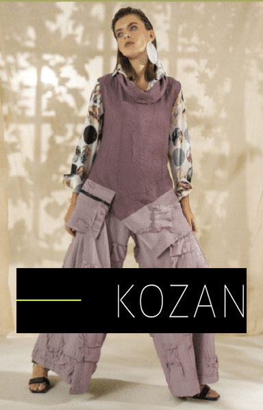 woman wearing Kozan lilac cargo pantsuit and large polka dotted shirt 